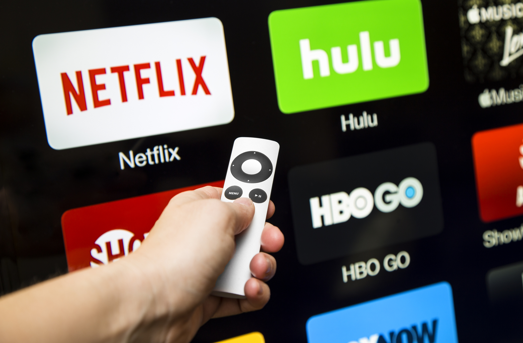 Canton, GA, USA - October 4, 2015 Netflix, hulu, and hbo subscription streaming video service accessed through a Apple tv and displayed on a hd tv. These application are paid services popular with cable cutters as an alternative to paying for cable.